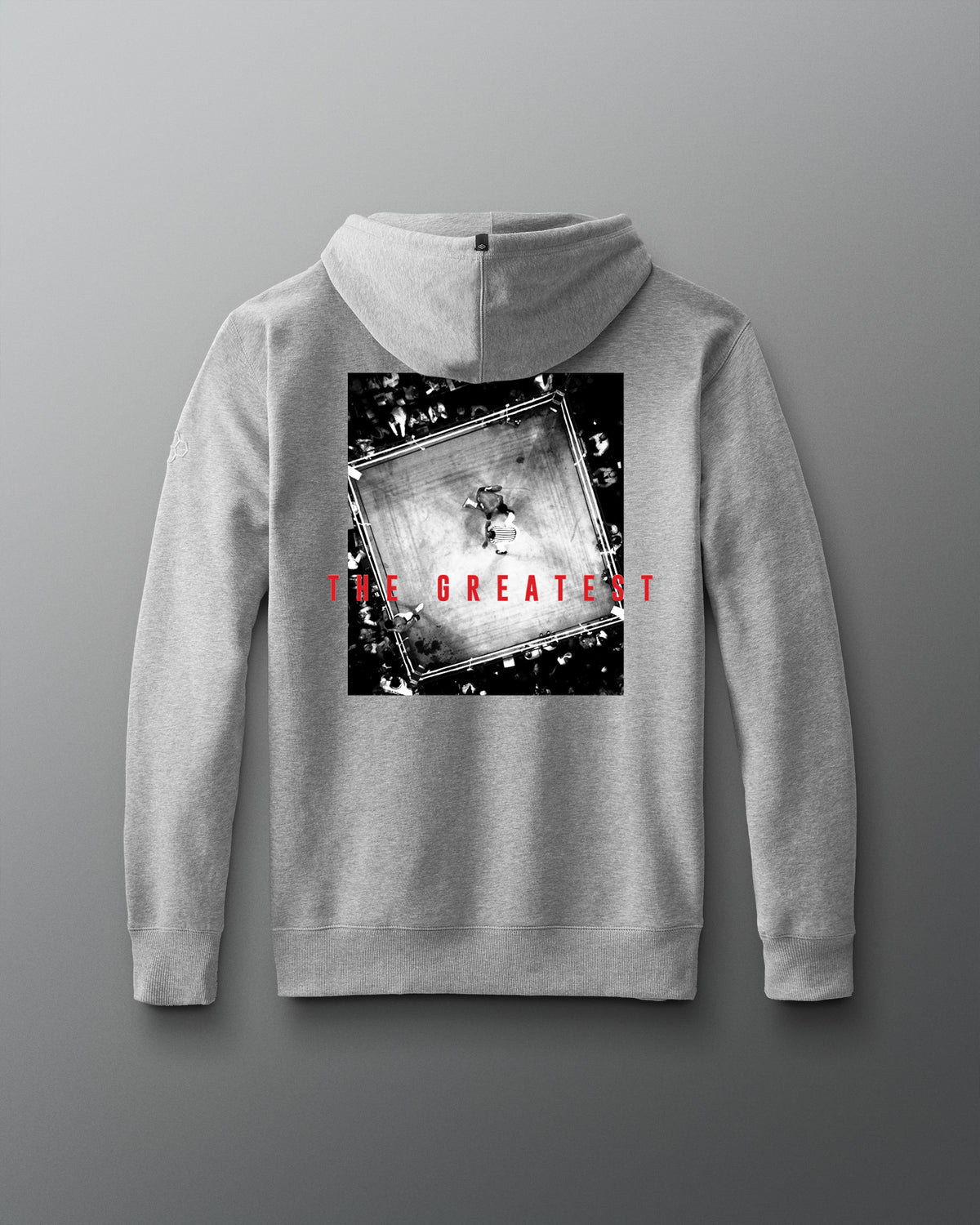RUDIS Ali The Greatest Comfort Fleece Hoodie in gray, featuring a black-and-white overhead boxing-ring image with bold red “THE GREATEST” lettering across the back.