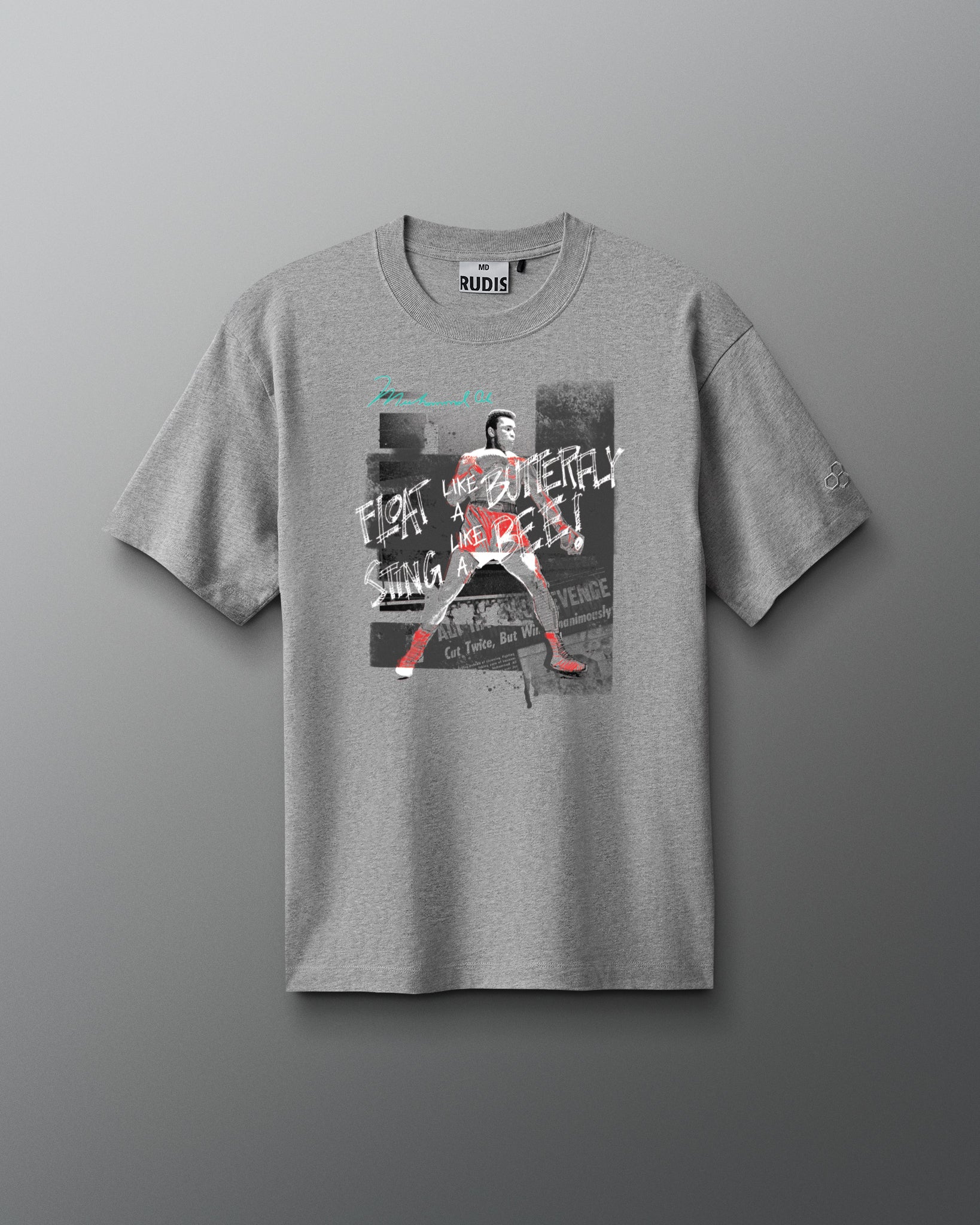 Gray t-shirt with graphic design on a gray background. Muhammad Ali