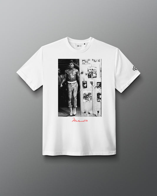 RUDIS Ali The Greatest Elite Supersoft T-Shirt in white, featuring a black-and-white Muhammad Ali training image, red signature detail, and RUDIS Hex sleeve branding.