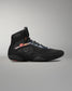 Black wrestling shoe with visible branding on a gray background