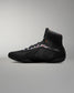 Black wrestling shoe on a gray background