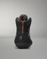 Black wrestling shoe with orange text on a gray background