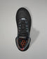 Black wrestling shoe with floral pattern on a gray background