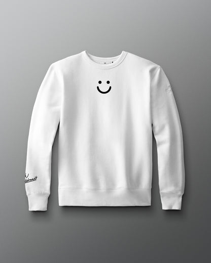 White sweatshirt with a smiley face design on a gray background