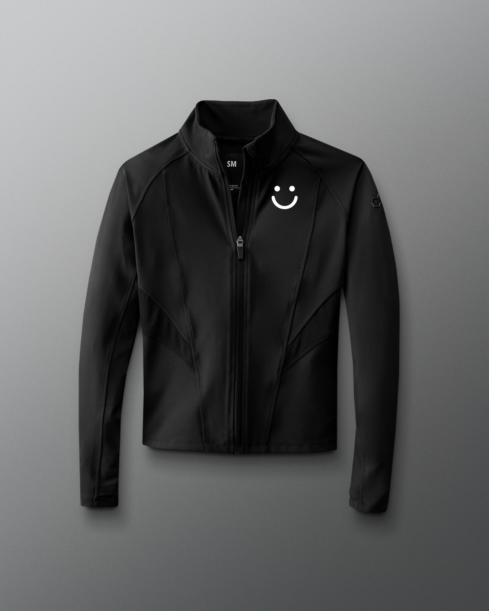 Black jacket with a smiley face logo on a gray background