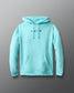 Light blue hoodie with small black graphics on a gray background