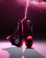 Black and pink wrestling shoes with a lightning bolt effect on a dark background