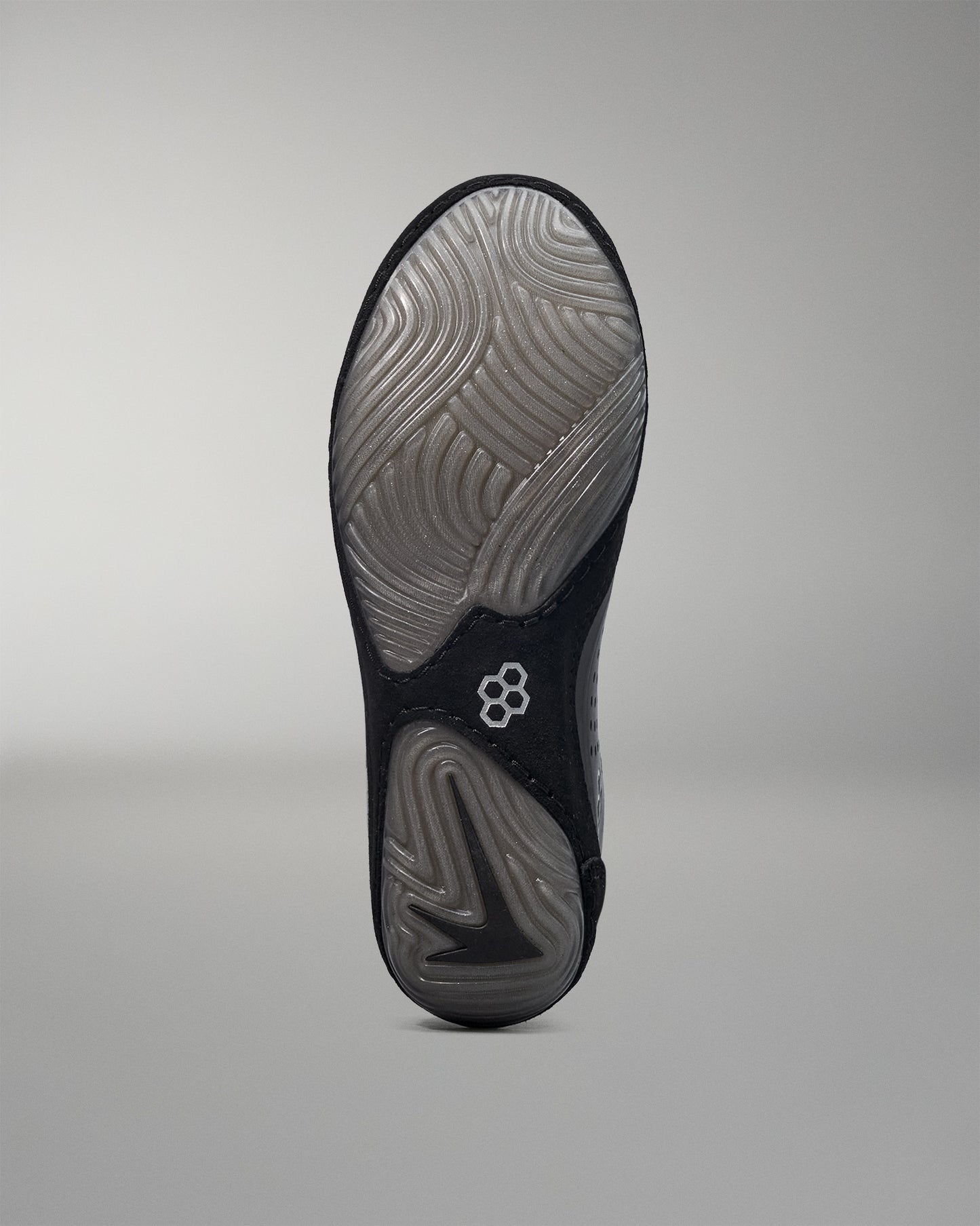 Bottom wrestling shoe - Black wrestling shoe sole with a brand logo on a gray background - Cary Kolat wrestling shoes