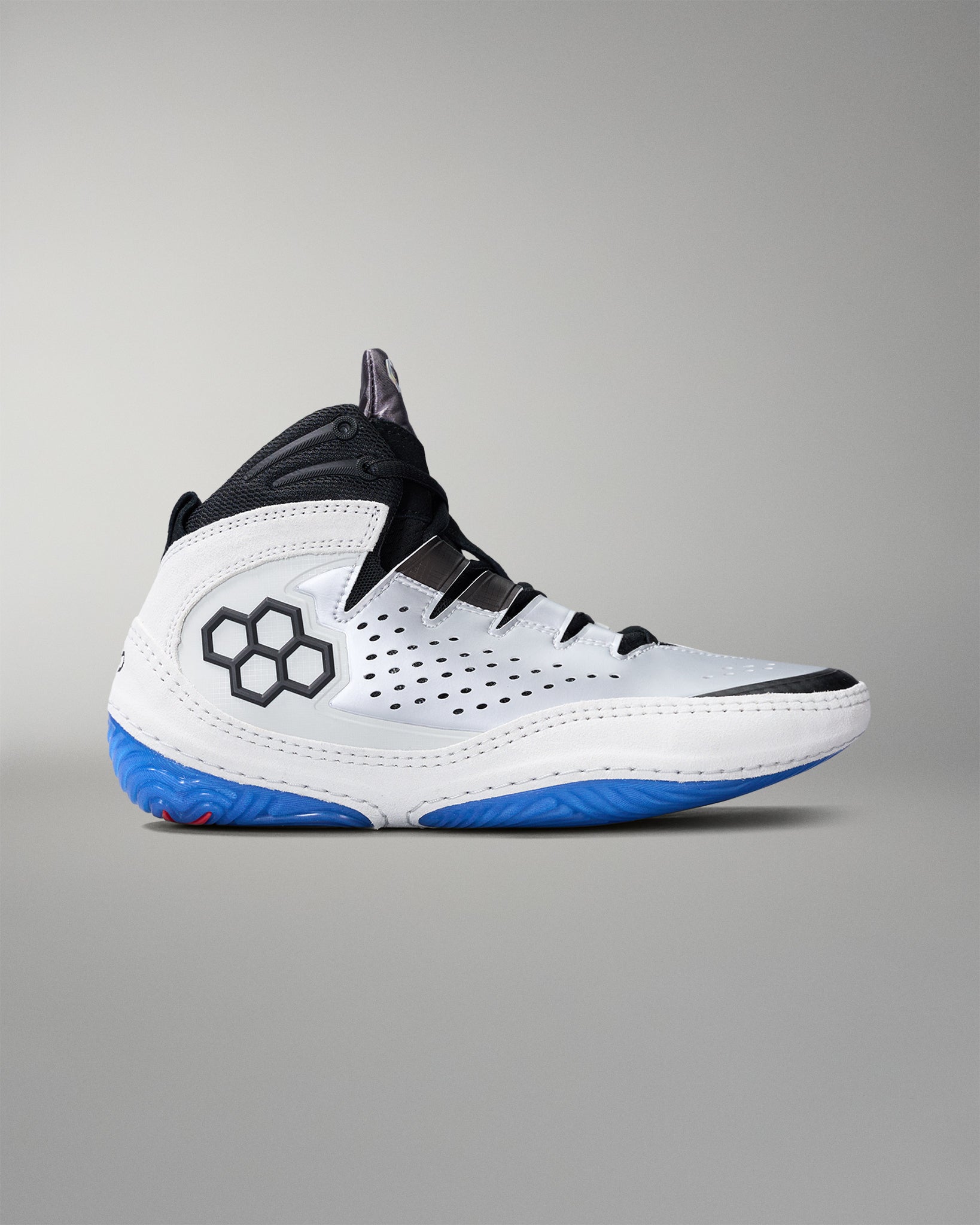 White wrestling shoe with blue sole on a gray background