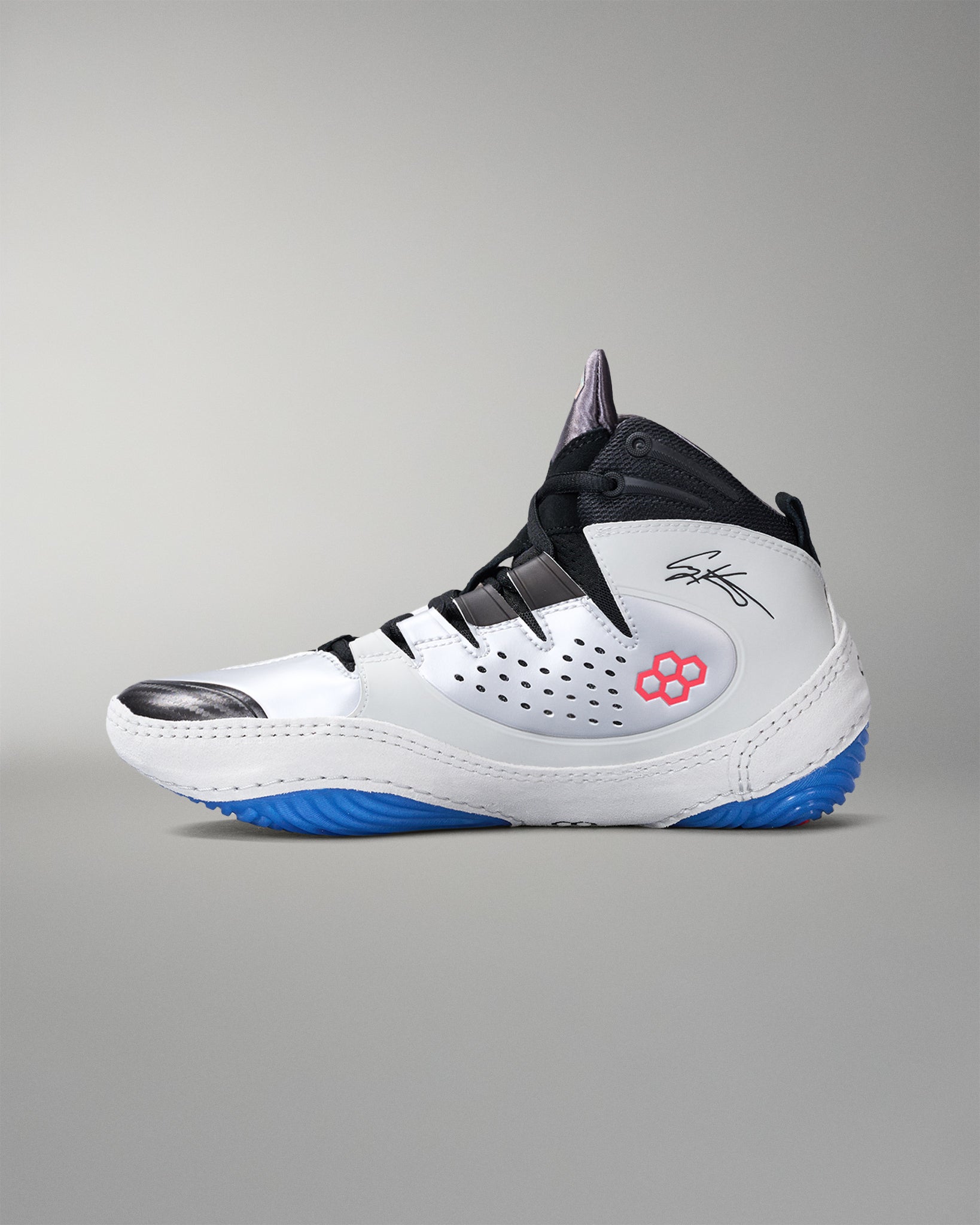 White wrestling shoe with black and blue accents on a gray background