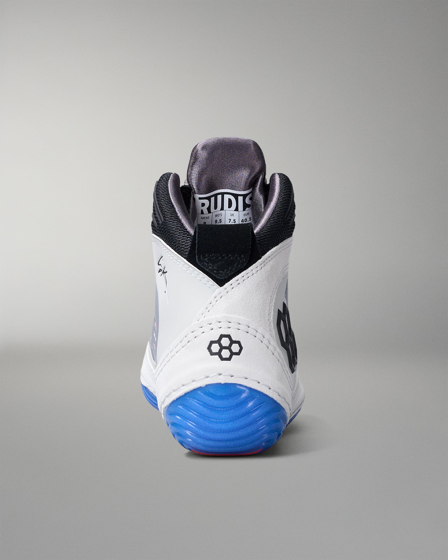 White wrestling shoe with blue sole on a gray background