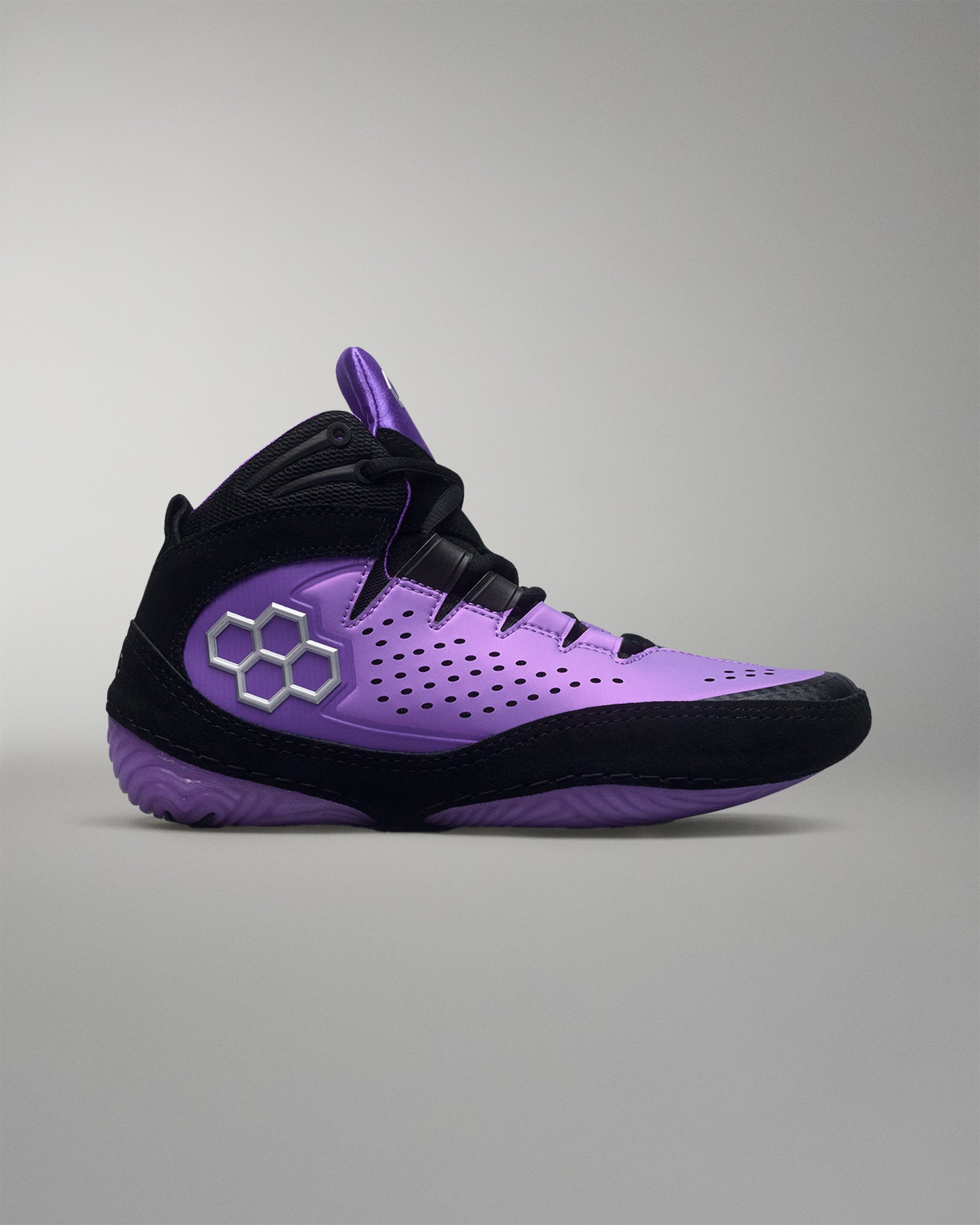 Purple and black wrestling shoe with a brand logo on a gray background