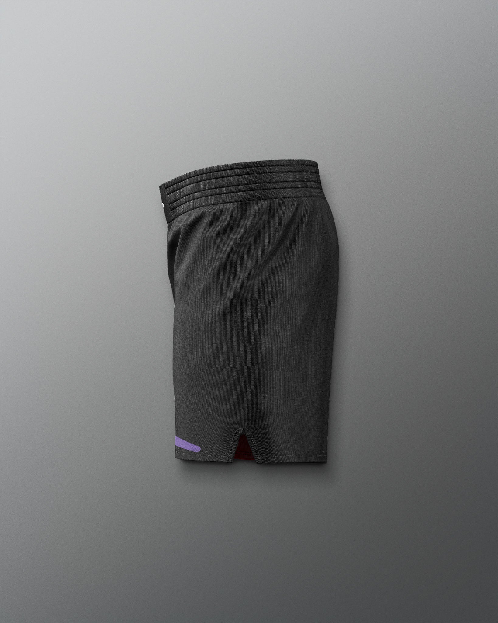 Black athletic shorts on a gray background