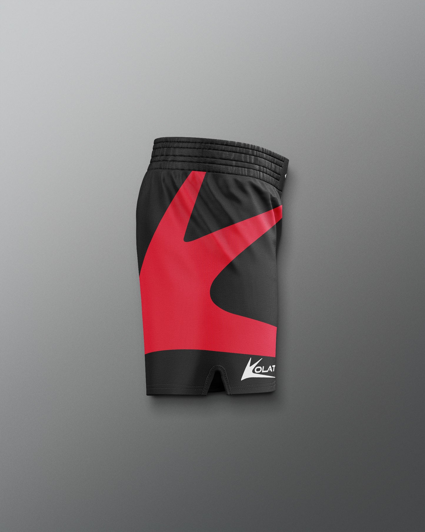 Black and red athletic shorts with a brand logo 'Kolat'  on a gray background