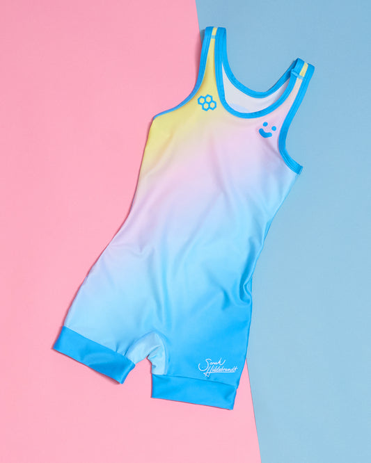 Gradient wrestling singlet with colorful design on a pink and blue background