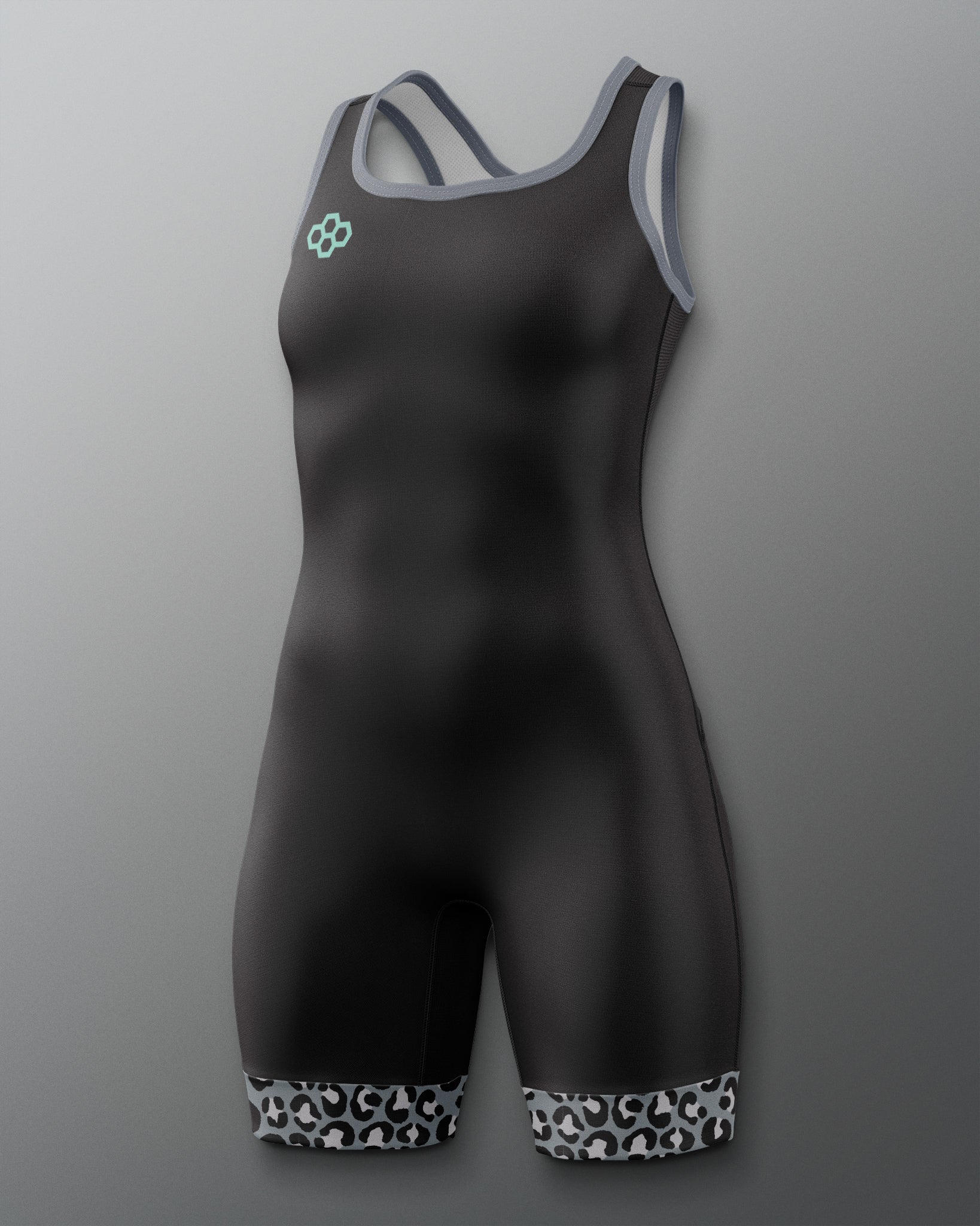 A black one-piece athletic wrestling singlet with gray trim on the straps and neckline, featuring a small mint green logo on the left chest and a black-and-white patterned hem at the legs, shown against a gray gradient background.