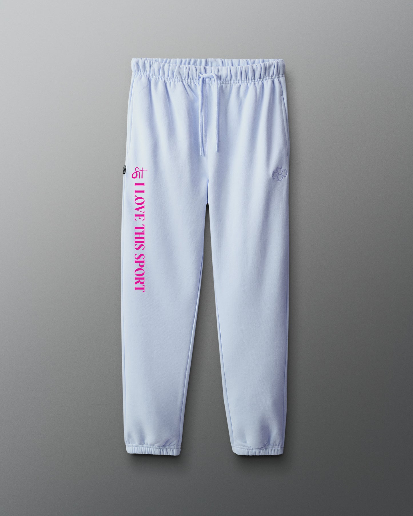 Light blue sweatpants with pink text on a gray background