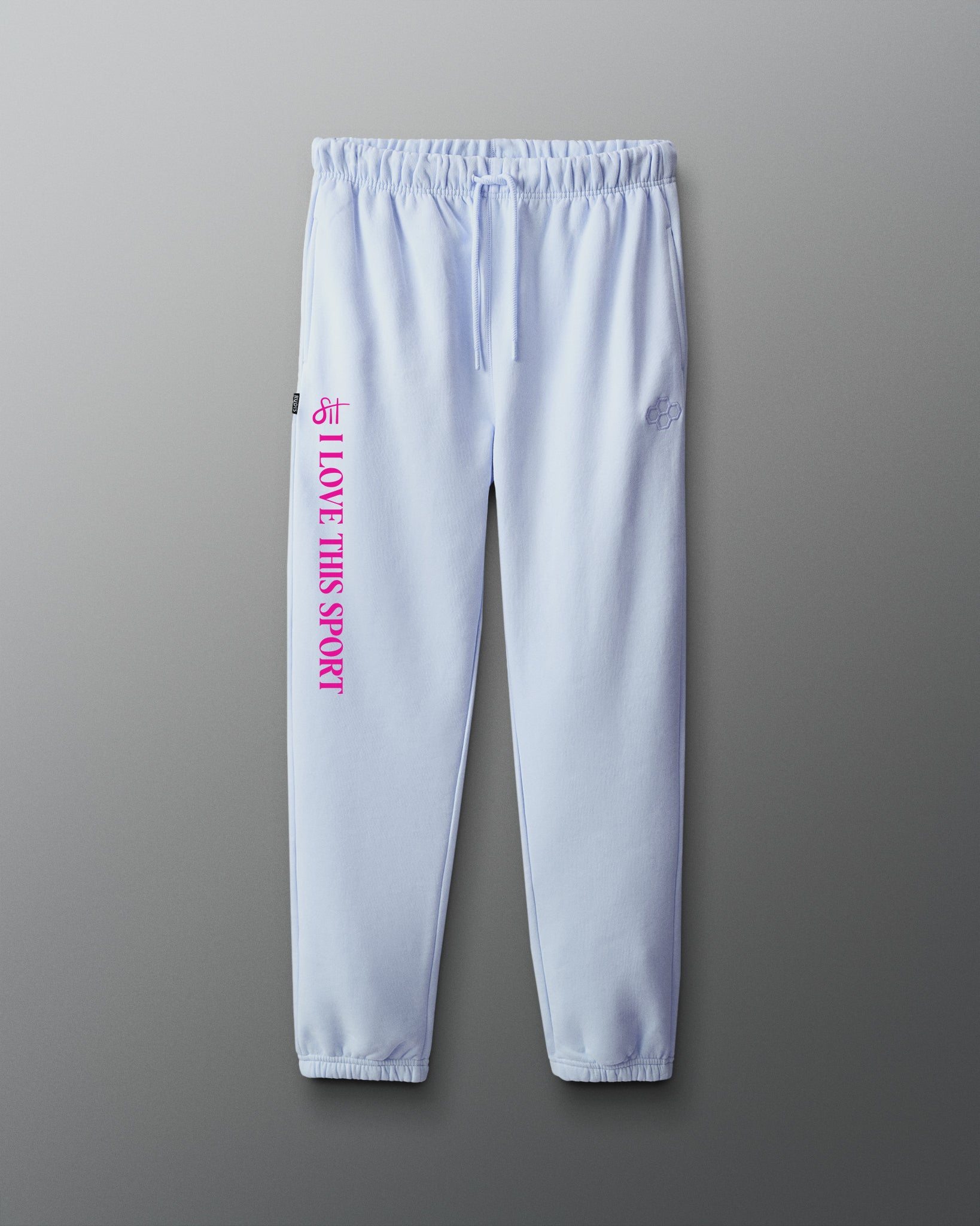 Light blue sweatpants with pink text on a gray background