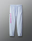 Light blue sweatpants with pink text on a gray background