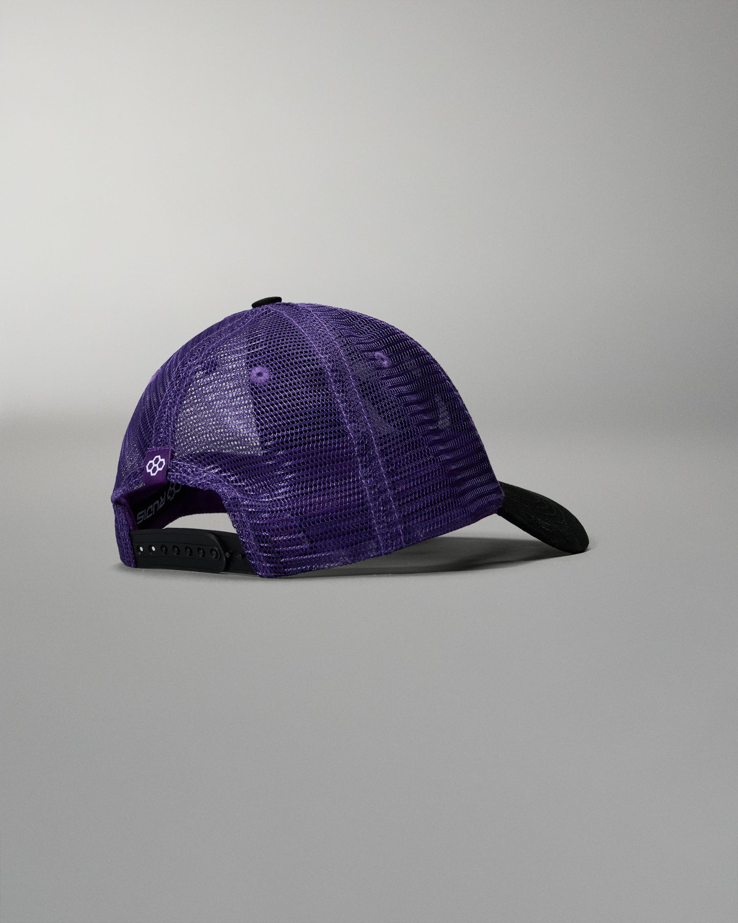Purple cap with black brim on a gray background
