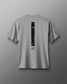 Gray t-shirt with 'HILDEBRANDT' logo on the back against a gray background