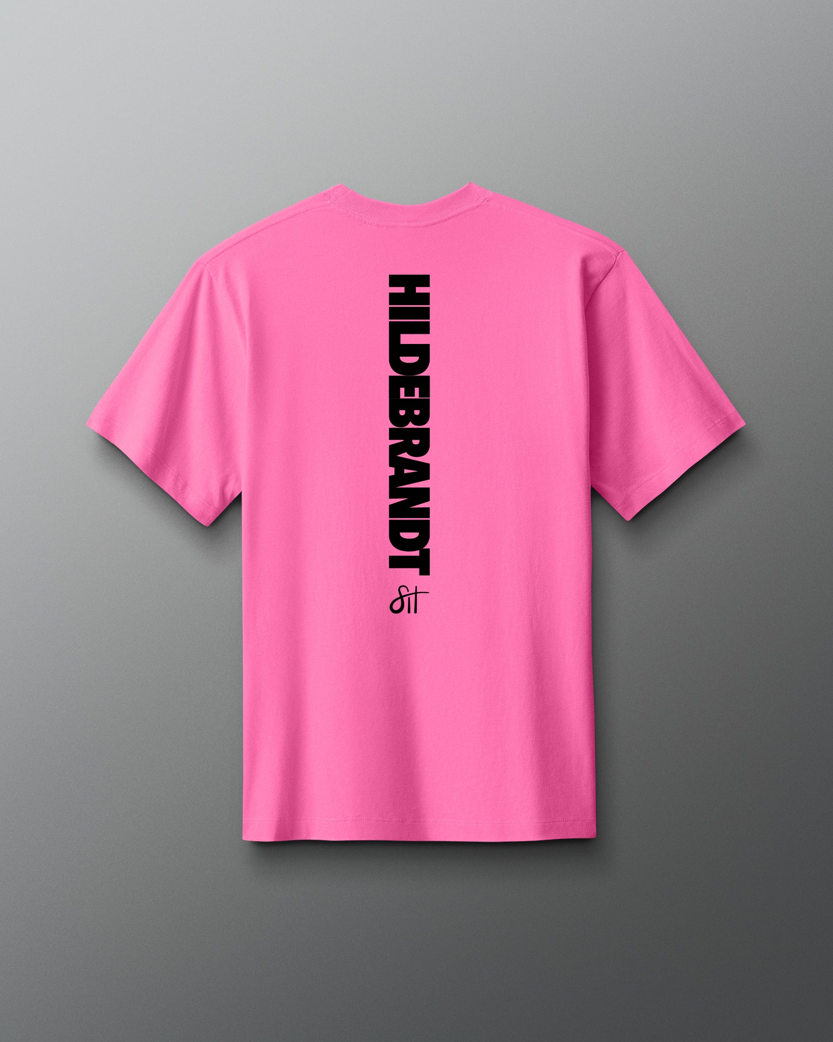 Pink t-shirt with 'HILDEBRANDT' logo on the back against a gray background