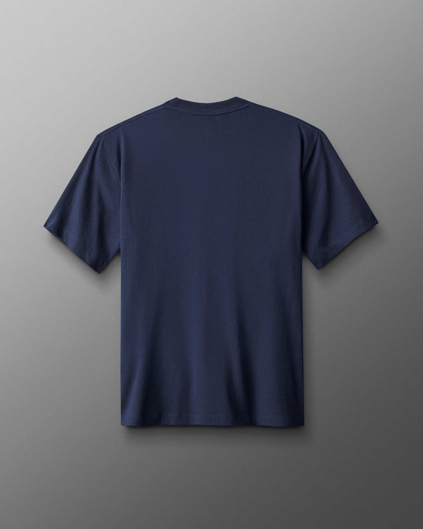 Navy blue t-shirt on a gray background