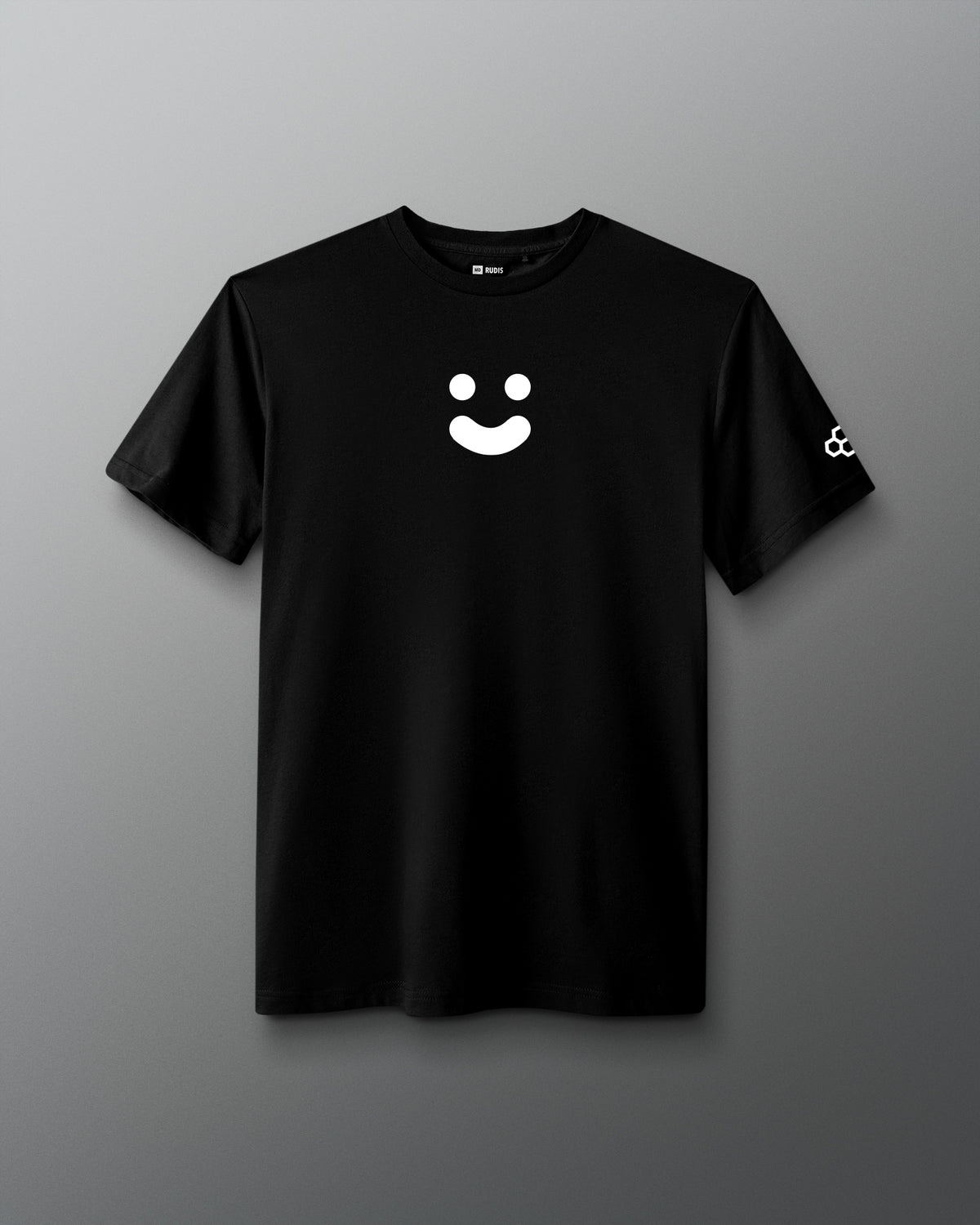 A black short-sleeve crewneck t-shirt featuring a white minimalist smiley face graphic on the center chest and a small white geometric logo on the left sleeve, displayed against a neutral gray background.