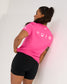 Back view of the pink RUDIS SH Smile Elite Super Soft T-Shirt featuring white signature, smile, lightning bolt, and RUDIS graphics.