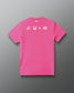A bright pink short-sleeve t-shirt shown from the back, featuring white minimalist graphic symbols across the upper back and the brand name 'RUDIS' printed in white at the inner neck, set against a dark gray gradient background.