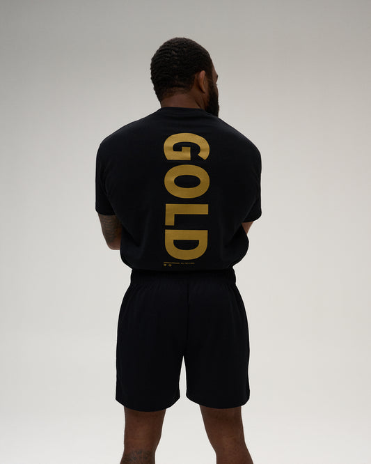 RUDIS JB GOLD Heavyweight T-Shirt in black, featuring an oversized metallic gold GOLD graphic across the back and signature Jordan Burroughs collection detailing.
