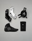 Collection of black and white wrestling gear including shoes, socks, and kneepads on a gray background.