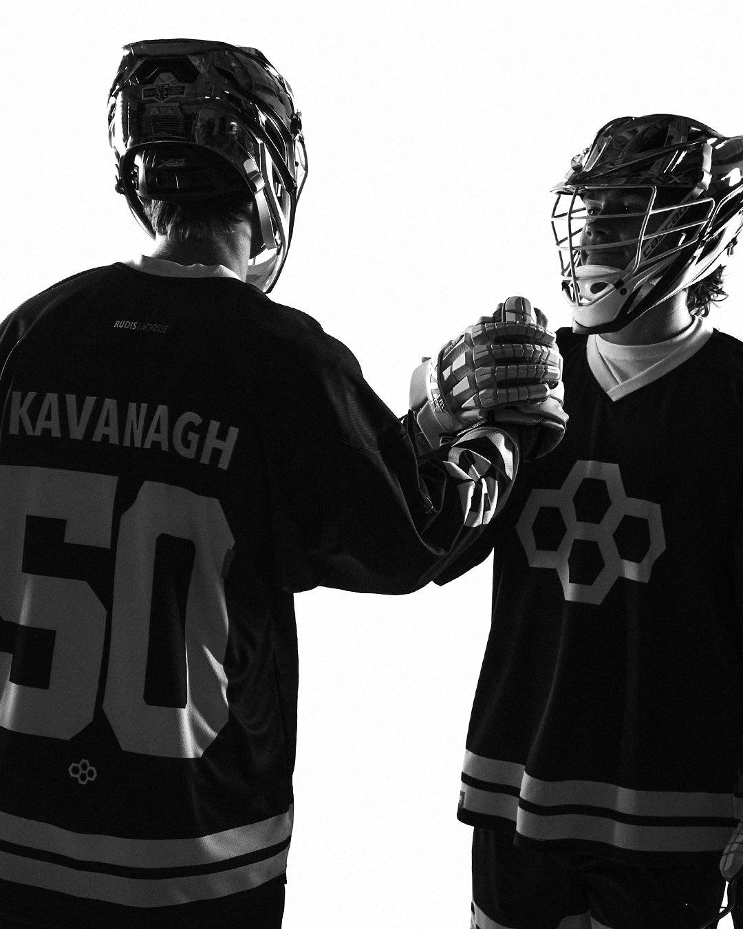 Pat Kavanagh and Chris Kavanagh wearing RUDIS lacrosse apparel, showcasing performance gear built for speed, teamwork, and elite competition.