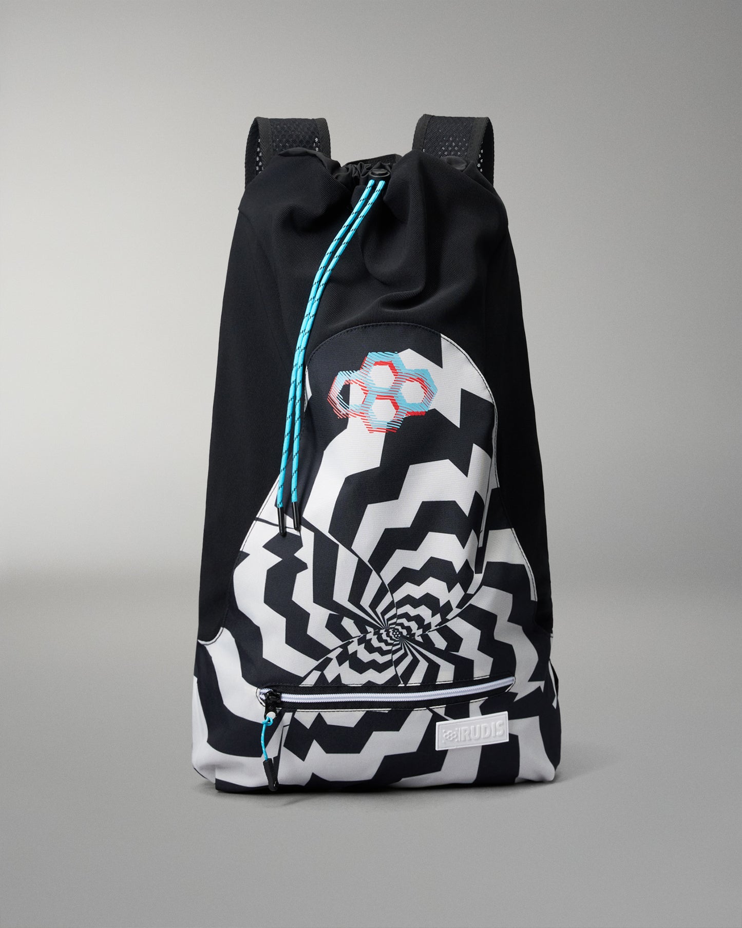 A black drawstring backpack with a large black and white optical illusion spiral graphic on the front pocket, a pink and blue geometric logo patch, and a small white label near the zipper.