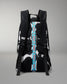 A black and white patterned backpack shown from the back, featuring a prominent vertical blue strap with white text reading 'RUDIS' and black mesh padding on the straps.