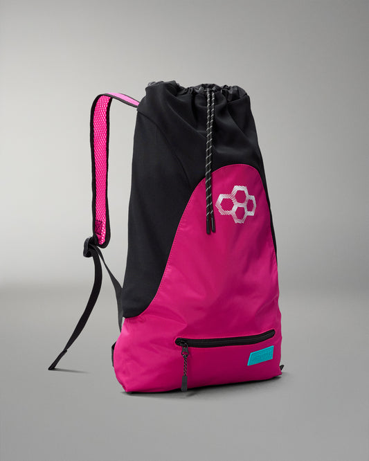 Pink and black drawstring bag with a logo on a gray background