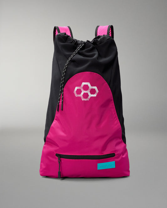 Pink and black drawstring bag with a geometric logo on a gray background