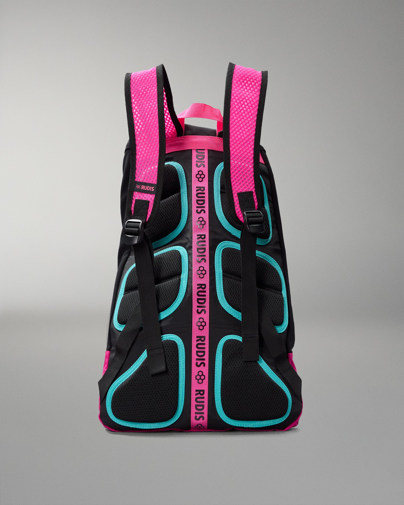Black backpack with pink straps and teal accents on a gray background