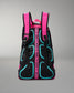 Black backpack with pink straps and teal accents on a gray background