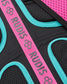 Close-up of a product with 'RUDIS' branding on a pink and teal strap.