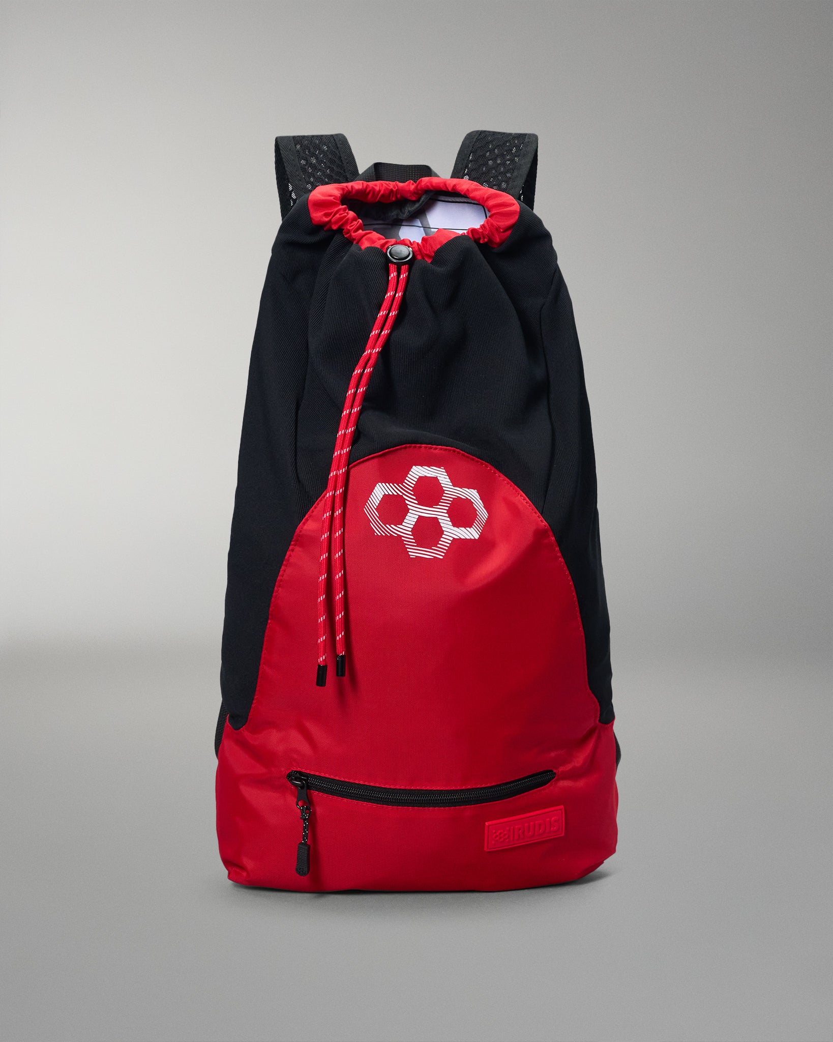 Black and red backpack with a geometric design on a gray background