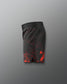 Black shorts with red splatter pattern on a gray background
