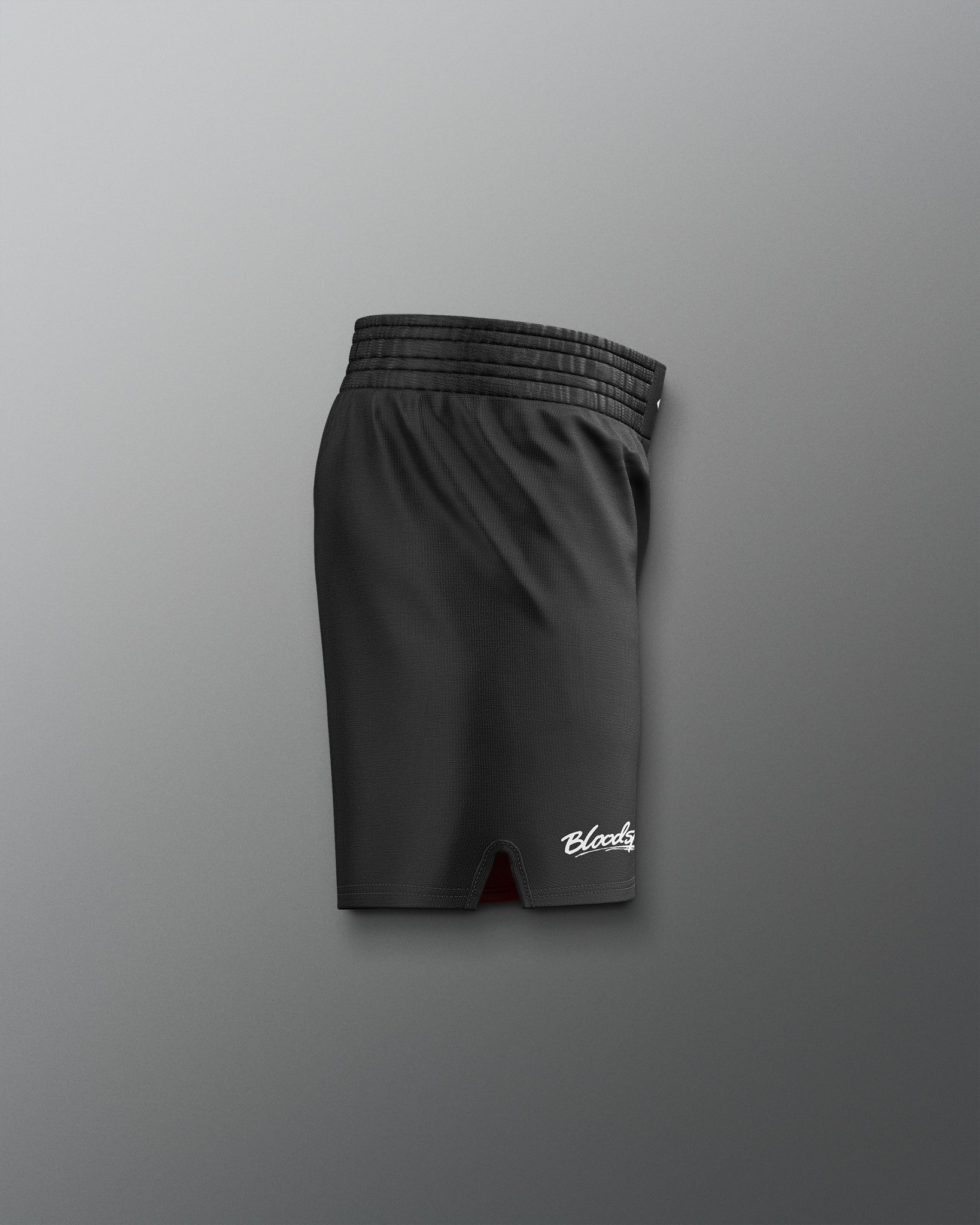 Black shorts with a brand logo on a gray background