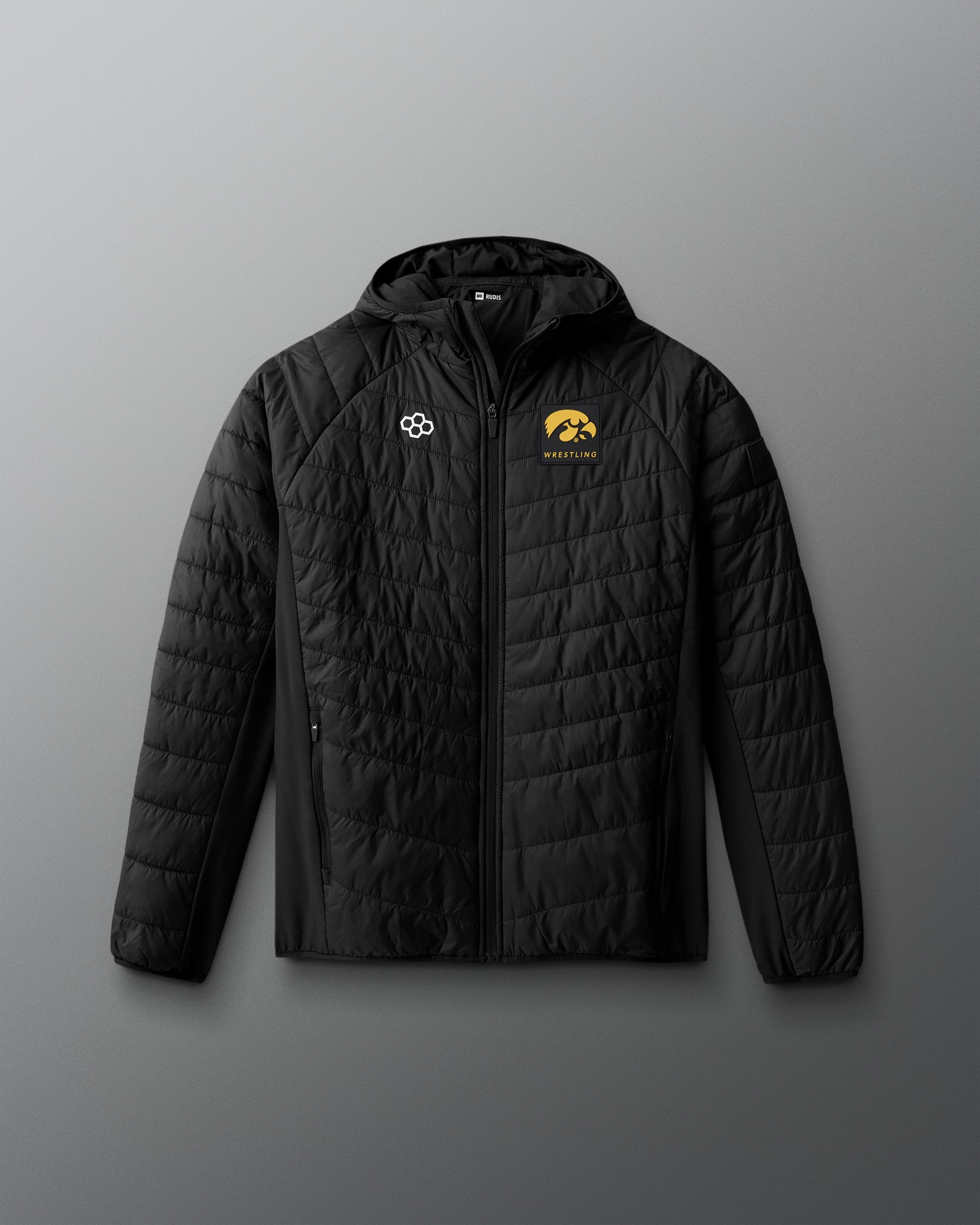 Black quilted jacket with logos on a gray background