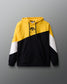 Color-blocked hoodie with yellow, black, and white sections on a gray background