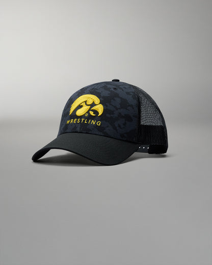 Black and yellow wrestling cap with Iowa Hawkeyes logo on a gray background