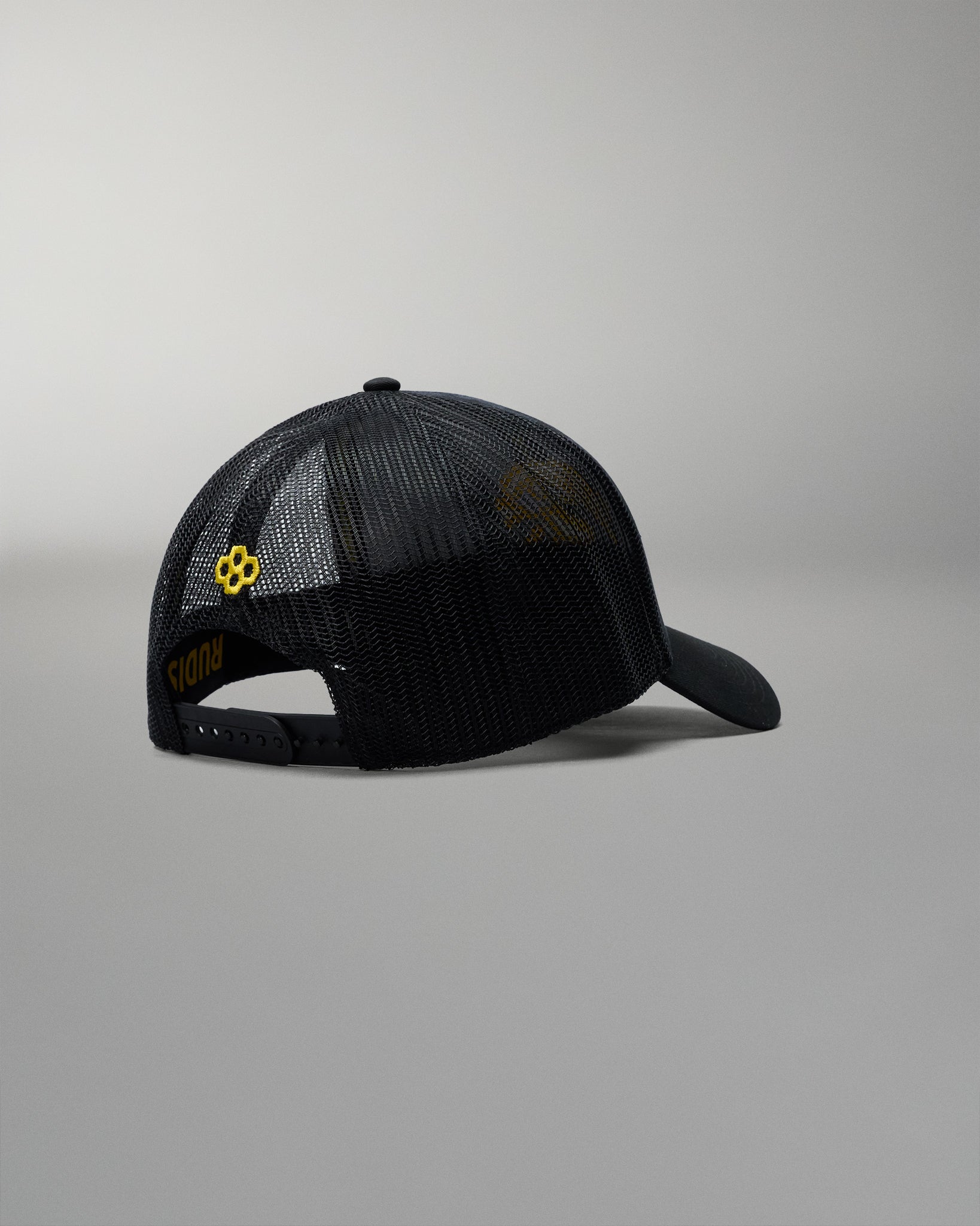 Black mesh cap with a logo on a gray background