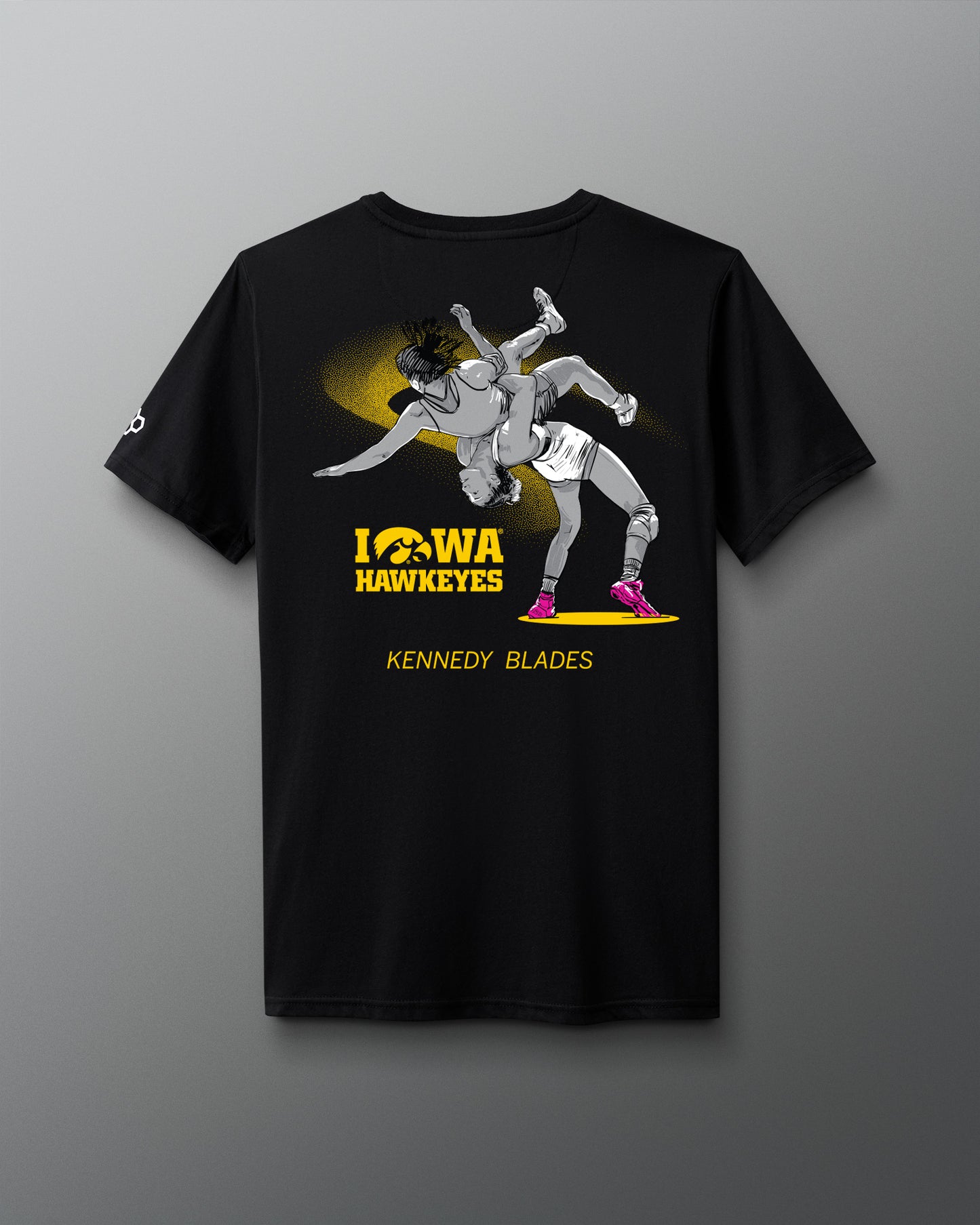 Black t-shirt with Iowa Hawkeyes wrestling graphic on a gray background