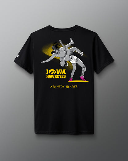 Black t-shirt with Iowa Hawkeyes wrestling graphic on a gray background