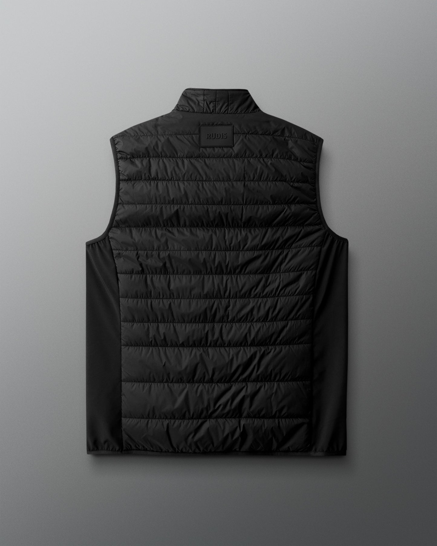 Black puffer vest on a light gray background